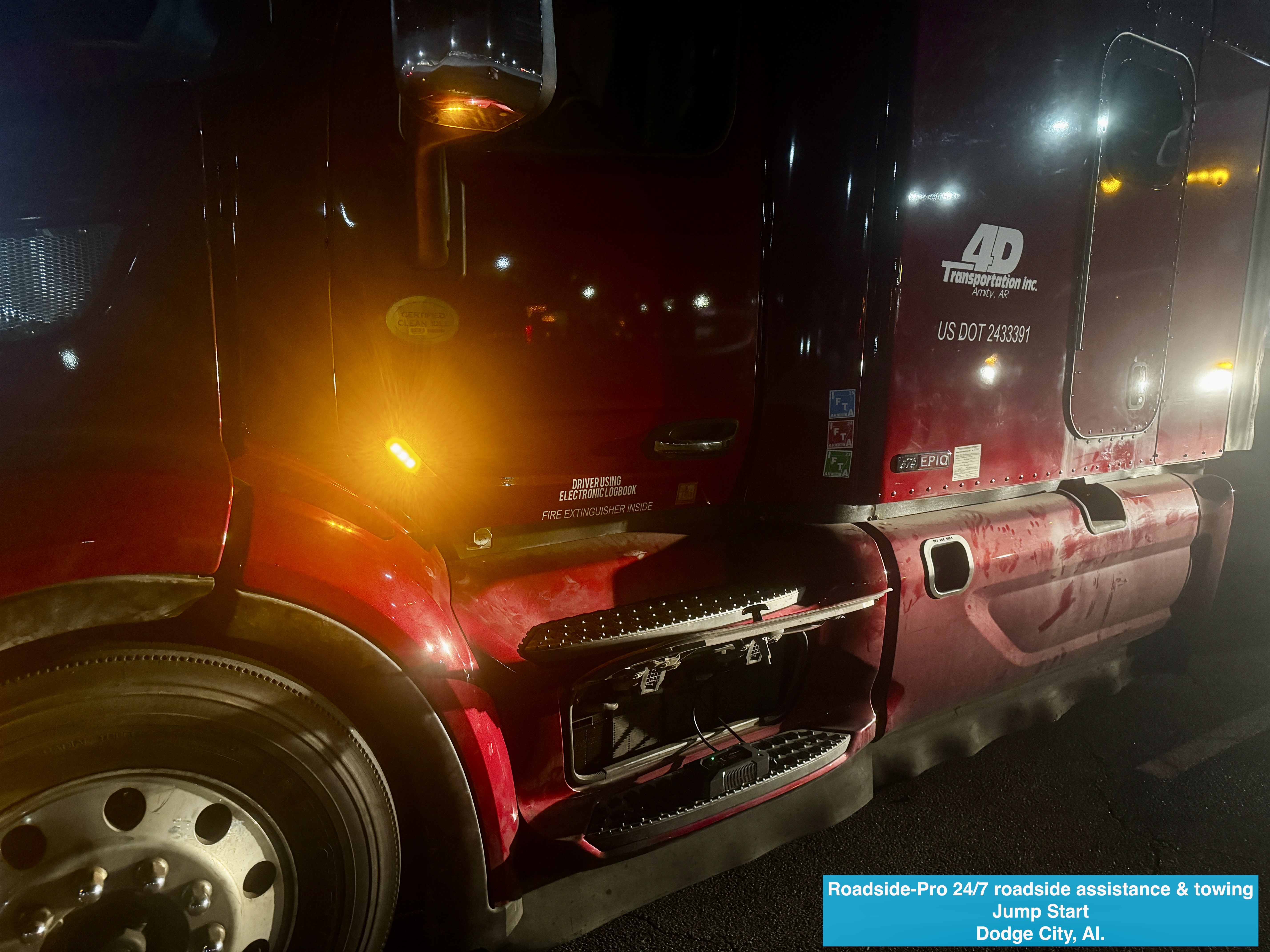 Roadside-Pro 24/7 roadside assistance & towing performing a jump start