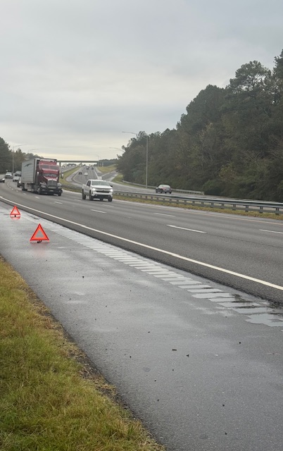 Roadside-Pro performing roadside fuel delivery to stranded motorist