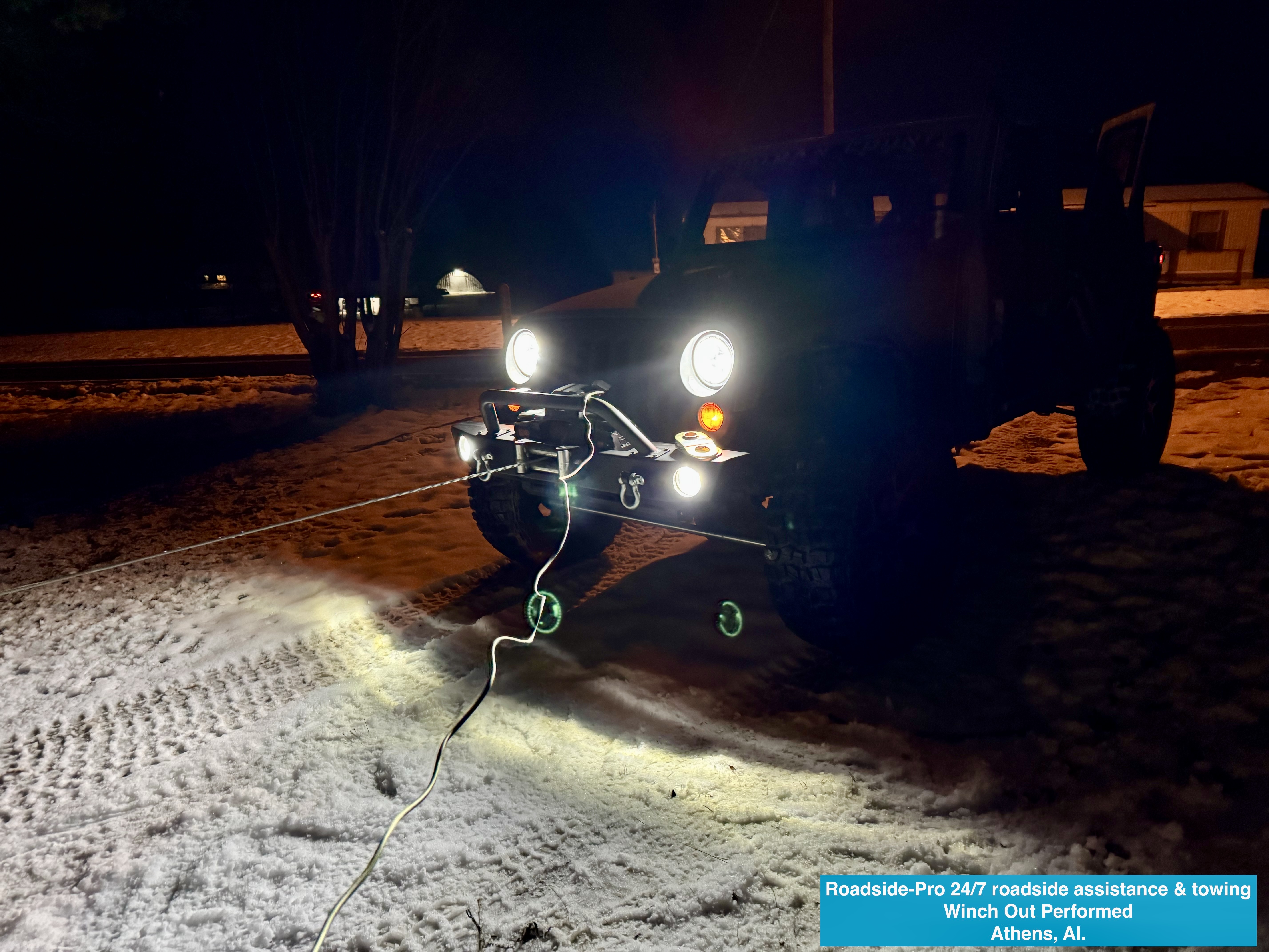 Roadside-Pro 24/7 roadside assistance & towing performing a winch out